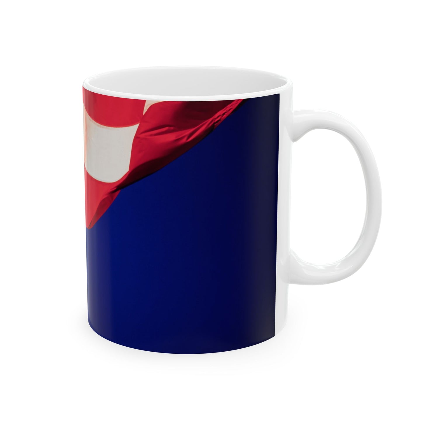 The Patriotic Colors of Red and White in the Stripes of the American Flag Wave Against a Deep Blue Sky, Perfect for an 11 or 15oz Mug.