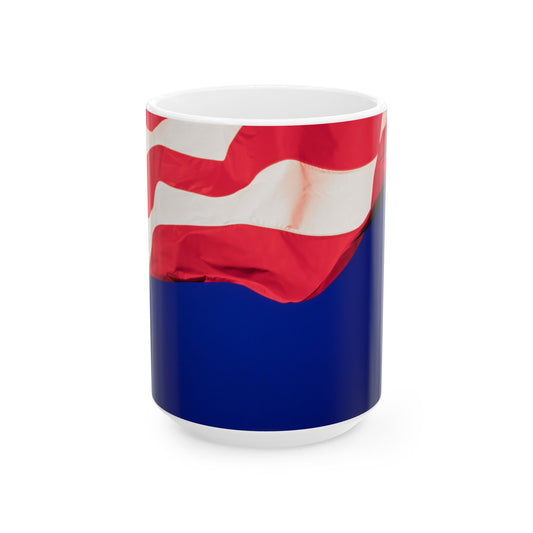 The Patriotic Colors of Red and White in the Stripes of the American Flag Wave Against a Deep Blue Sky, Perfect for an 11 or 15oz Mug.
